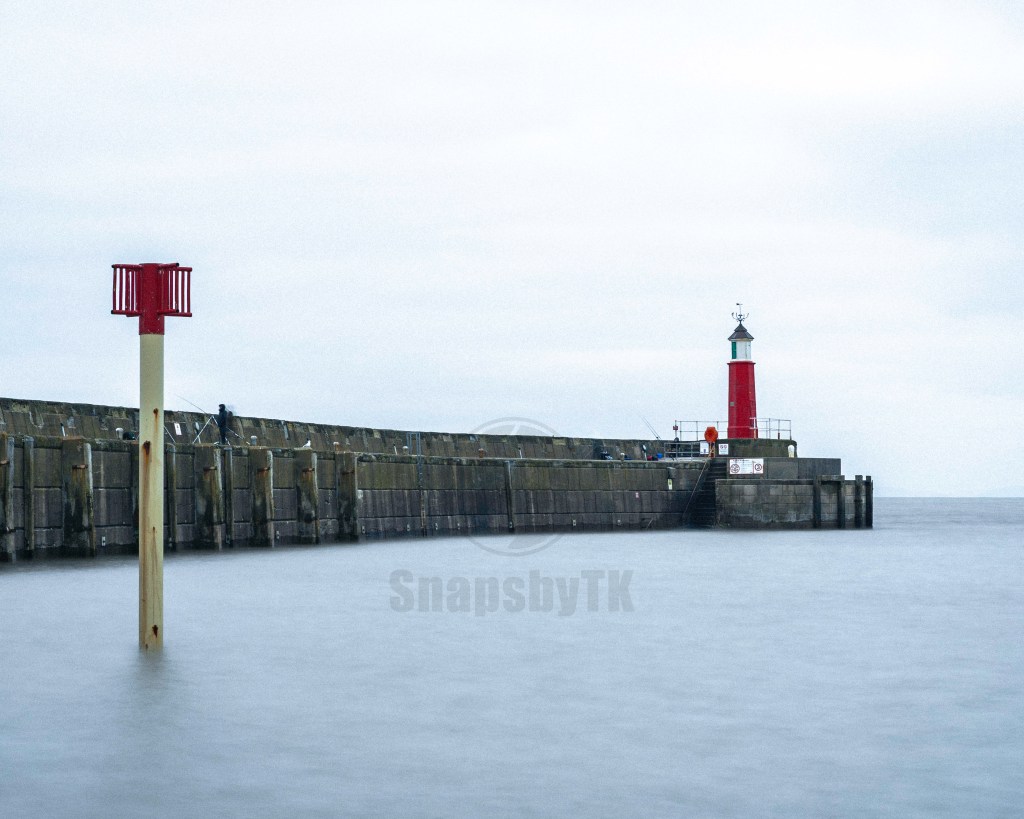 Watchet Lighthouse and pier wall long exposure seascape